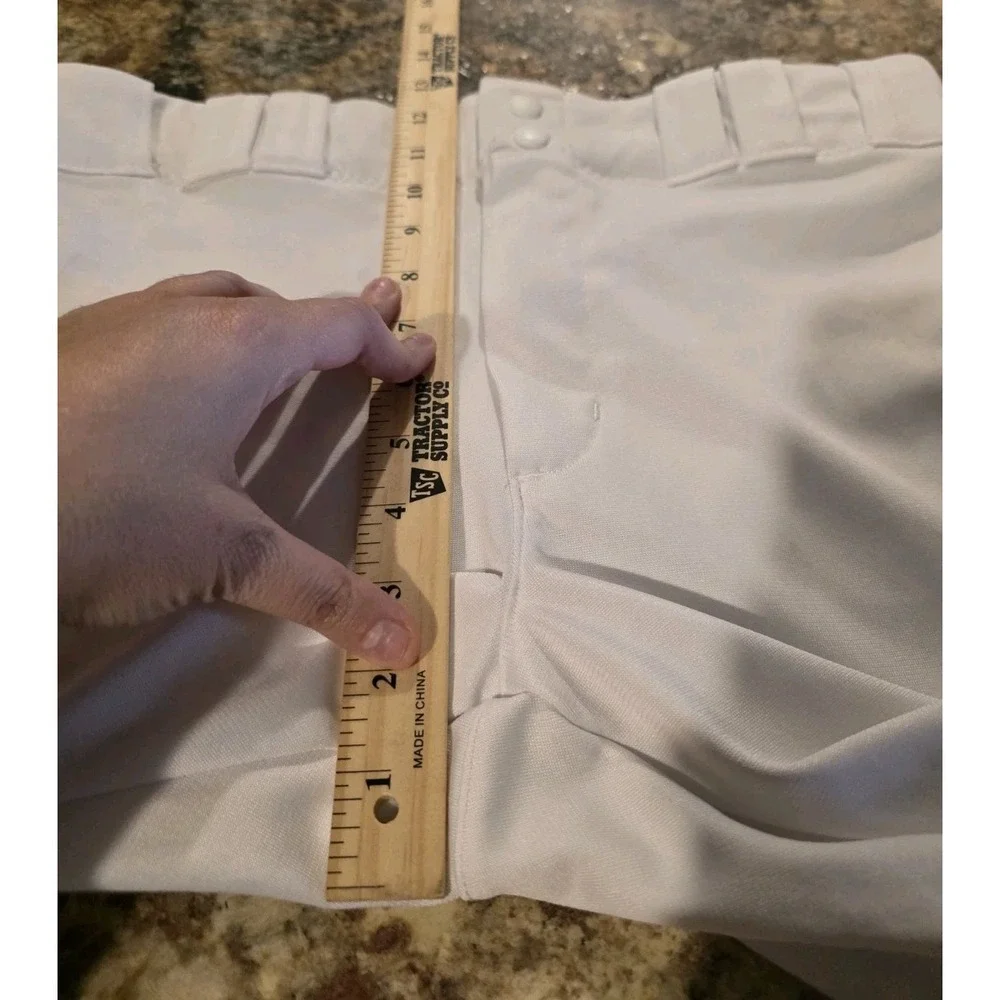 Under Armour branded inner waistband, tunnel belt loops, double snap closure. LG